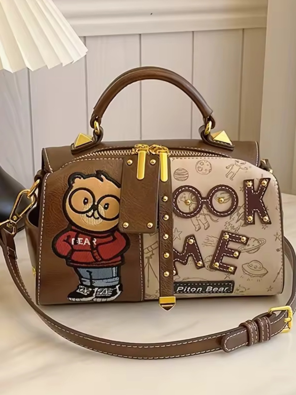 New designer inspired Brown Cartoon Patch Dome Satchel with Gold Hardware